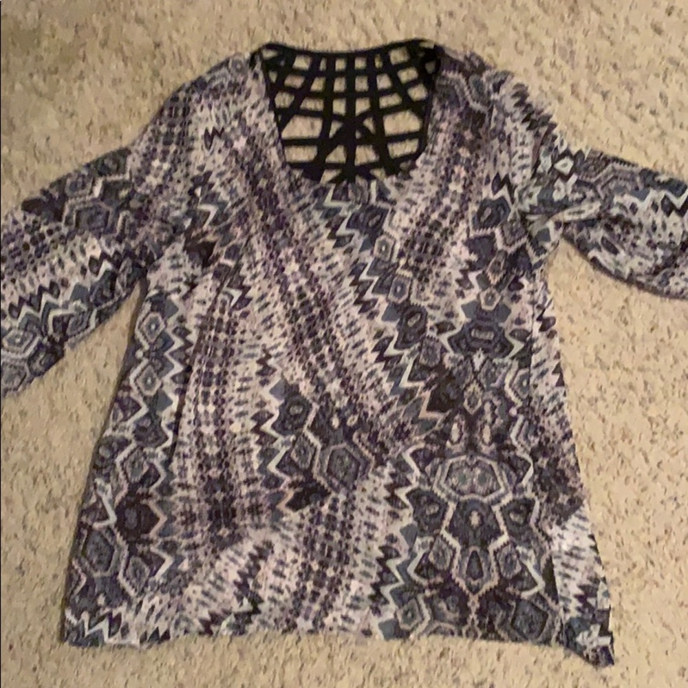 Sheer waist length tunic.